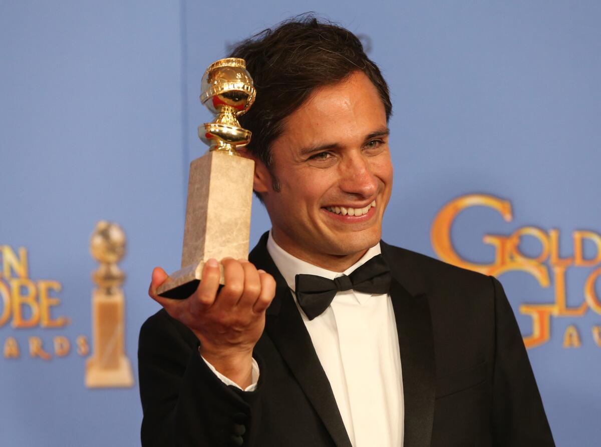 Gael Garcia Bernal, star of "Mozart in the Jungle," grasps his Golden Globe for actor in a comedy series backstage at the Beverly Hilton Hotel.