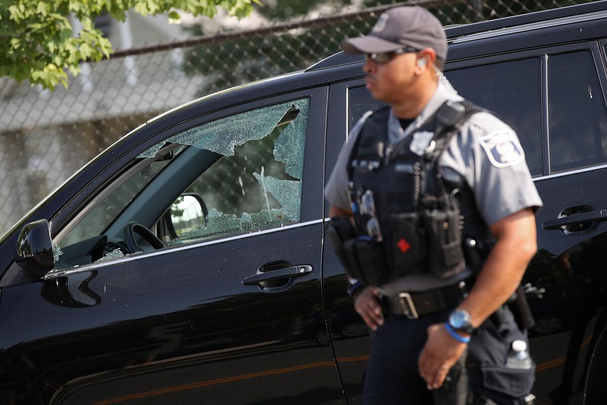 An officer stands guard near Eugene Simpson Stadium Park, the site in Alexandria, Va., where a gunman opened fire on a congressional baseball practice.