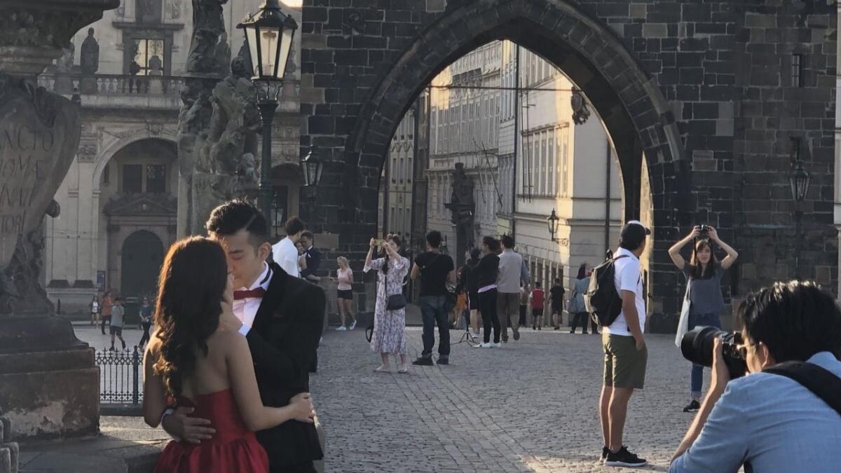 Erica Leung, 26, poses with fiance Sze Sze, 28, for pre-wedding pictures in Prague, the Czech capital. 