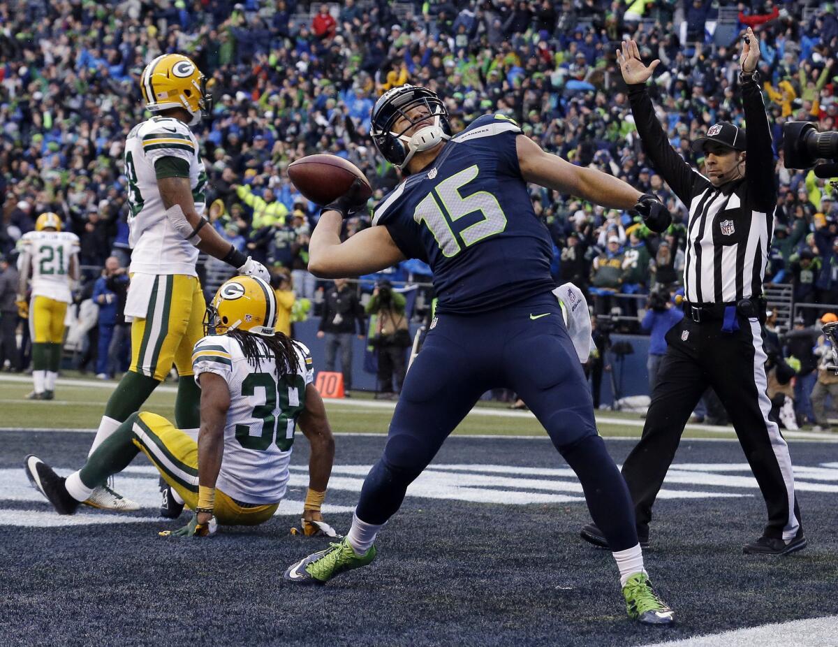 Seahawks receiver Jermaine Kearse celebrates after scoring the game-winning touchdown against the Packers in overtime Sunday.