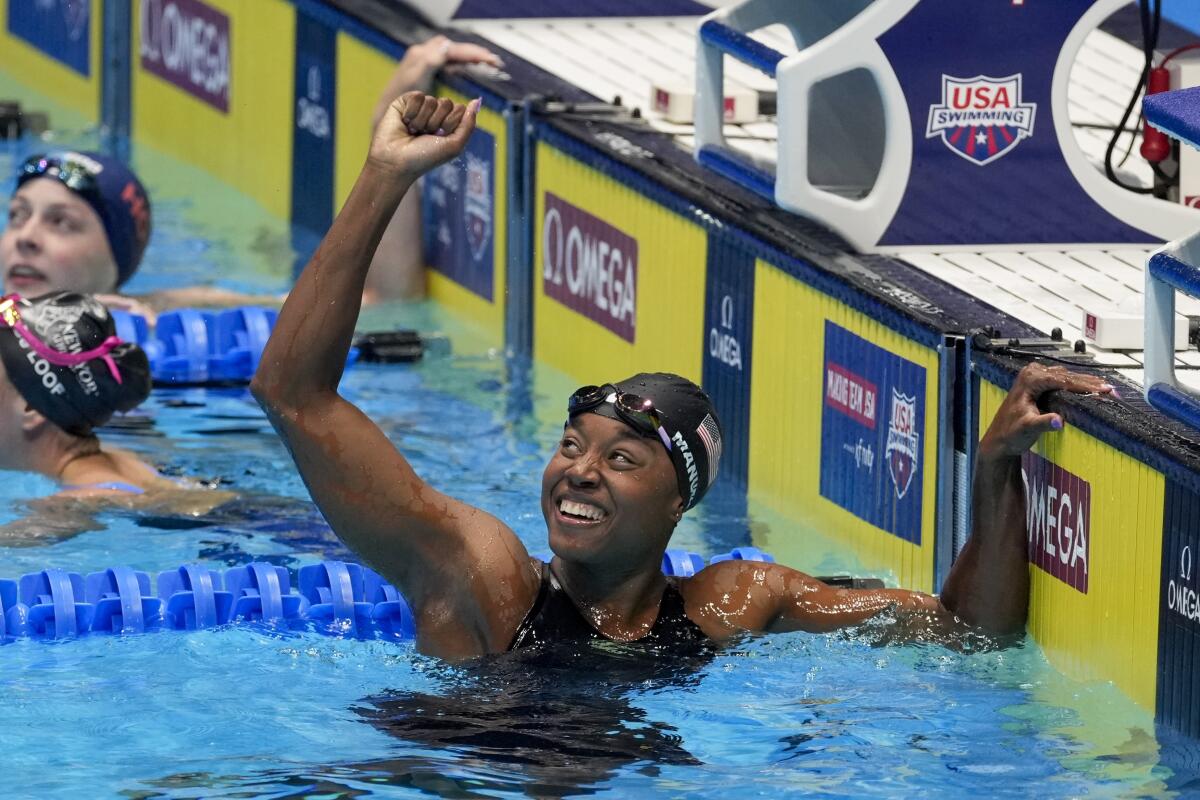 Simone Manuel celebrates after winning the women's 50-meter freestyle at the U.S. Olympic swimming trials.