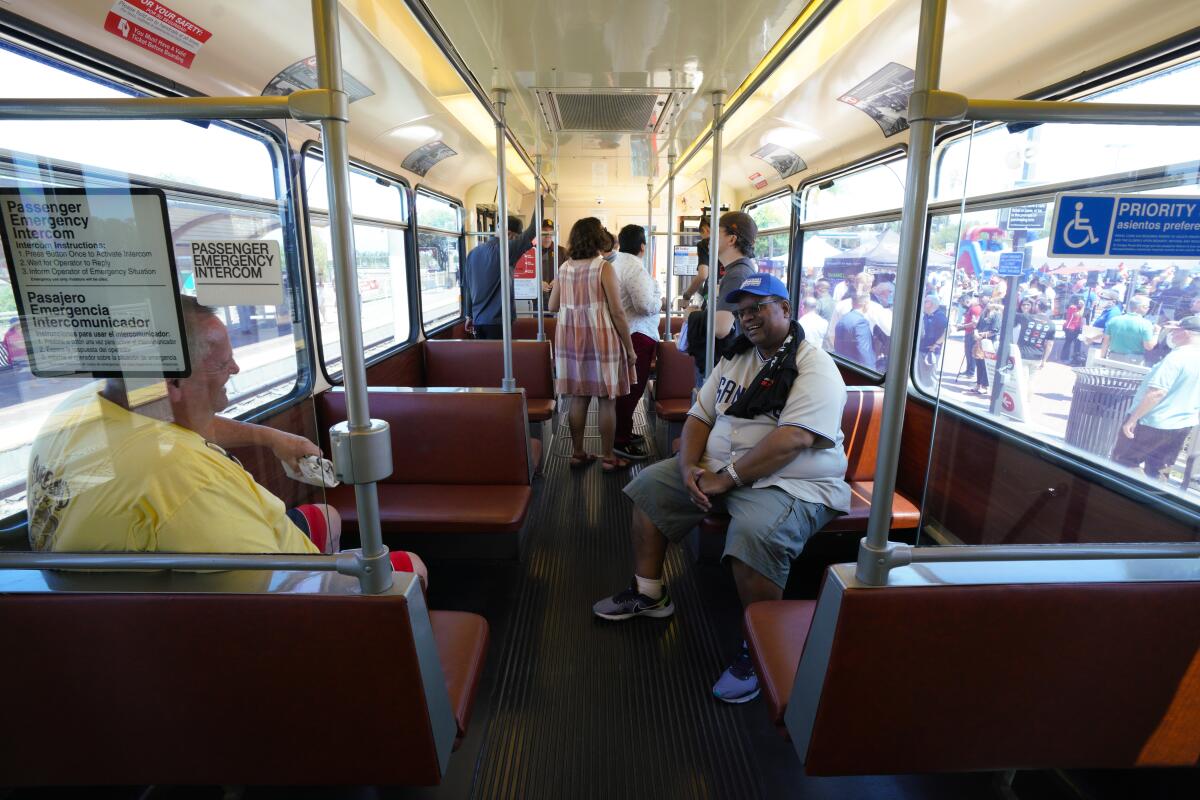 People inside a San Diego Trolley car