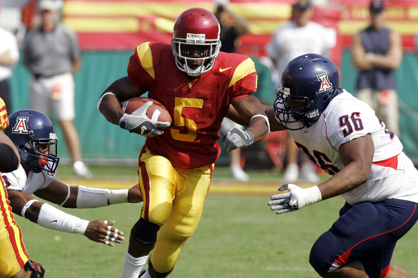 USC's Reggie Bush rushes during a game against Arizona on Oct. 8, 2005 at the Coliseum.