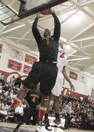 Fairfax center Renardo Sidney, who had 26 points and five blocked shots, pulls down one of his 22 rebounds against Westchester on Friday night.