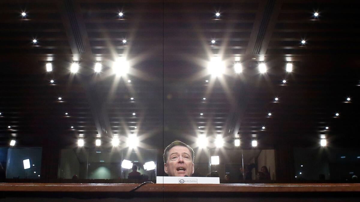 Former FBI Director James Comey speaks during a Senate Intelligence Committee hearing on Capitol Hill on June 8 in Washington.