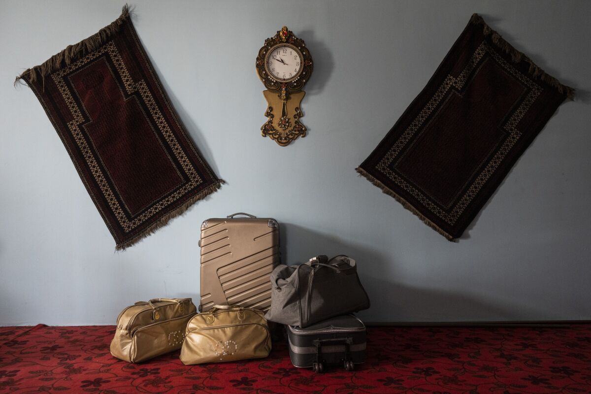 Travel bags from a family of Afghan musicians are packed and stored in a living room in Kabul, Afghanistan, Thursday, Sept. 23, 2021. Despite none of the family members having visas to travel outside Afghanistan, they have their bags packed while waiting for an opportunity to leave the country. (AP Photo/Bernat Armangue)