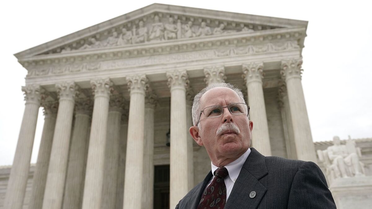 Mark Janus, who says his union's requirement that workers pay a representation fee violates his 1st Amendment rights, is shown at the U.S. Supreme Court on Monday after the hearing in his case.