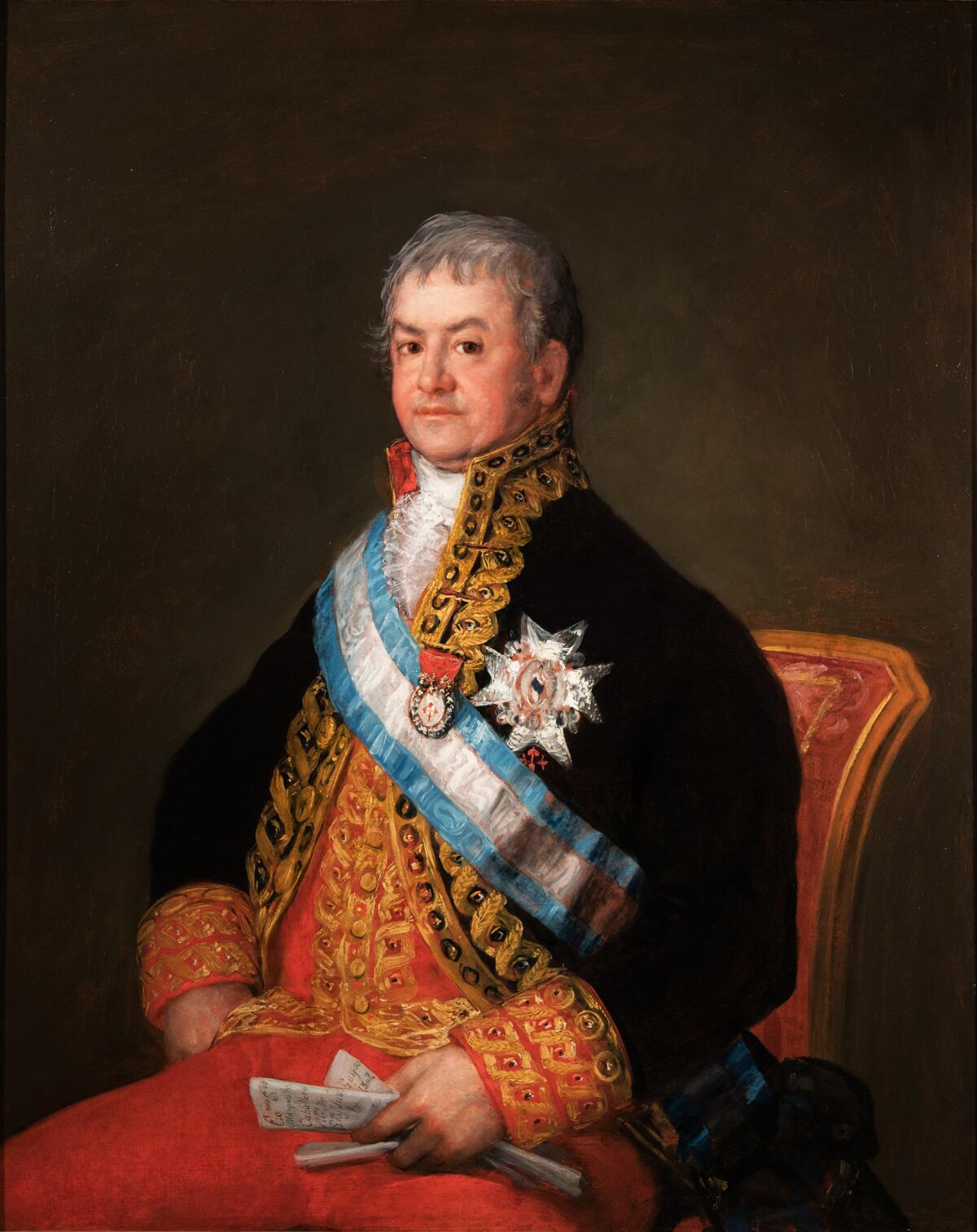 A portrait of José Antonio Caballero wearing a black jacket with gold embroidery and decorated with medals