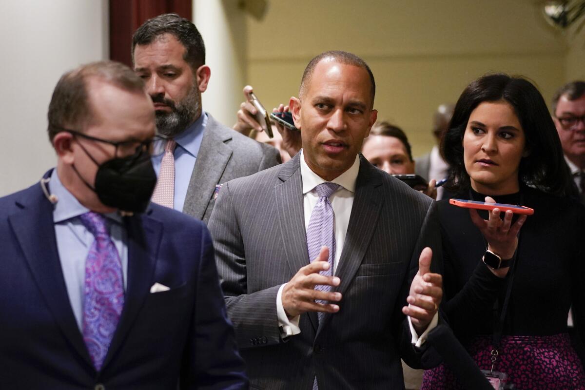 Rep. Hakeem Jeffries gesturing while talking with reporters