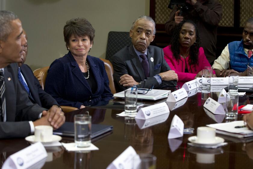 #BlackLivesMatter activist Deray McKesson, right, in the blue vest, meets with President Barack Obama and prominent civil rights leaders in the Roosevelt Room of the White House on Feb. 18.