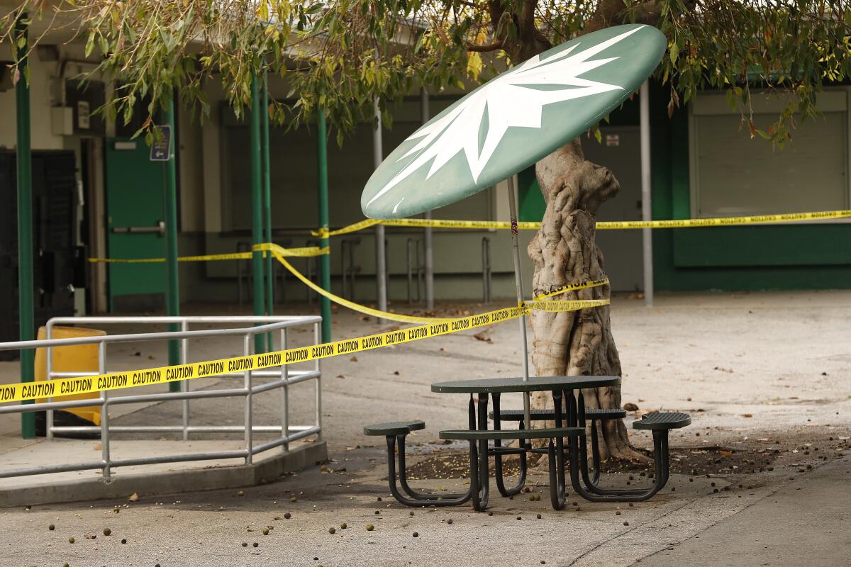 Common areas are marked with yellow caution tape at closed Dorsey High School