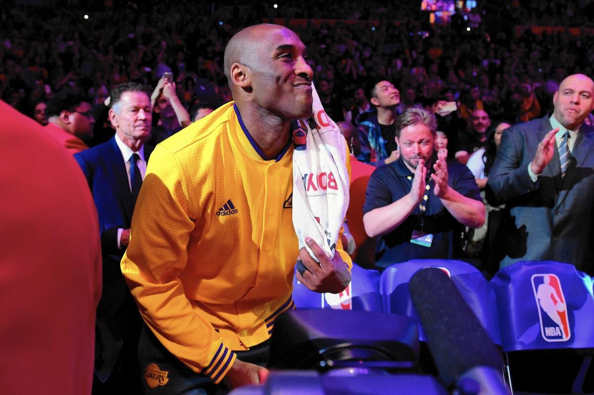 Kobe Bryant of the Los Angeles Lakers smiles as a video is played before taking on the Utah Jazz in his final NBA game at Staples Center on Wednesday in Los Angeles.