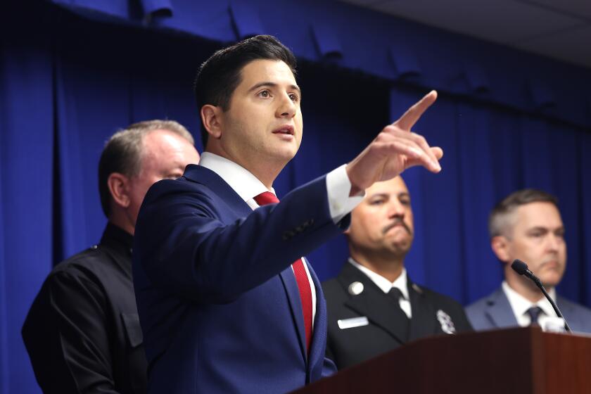 LOS ANGELES, CA, OCTOBER 8, 2025: Acting United States Attorney Bill Essayli takes questions from the press during a news conference announcing the arrest of 29-year-old Jonathan Rinderknecht, of Florida, a suspect in the Palisades fire after a nine-month investigation into the blaze that killed 12 people, at the United States Courthouse in downtown Los Angeles on Wednesday, October 8, 2025. Among the evidence that were collected from his digital devices were images he generated on ChatGPT depicting a burning city, said U.S. Attorney Bill Essayli. (Christina House / Los Angeles Times)