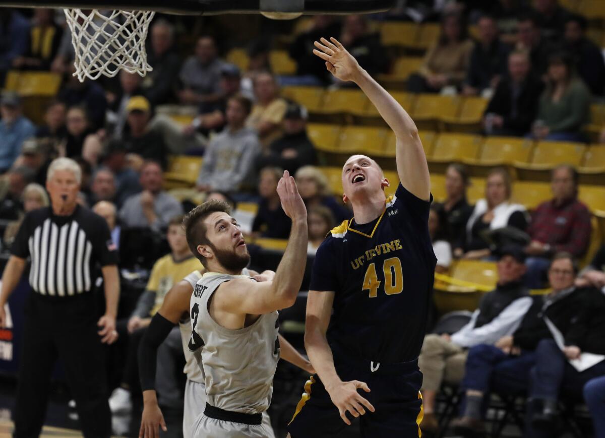 UC Irvine forward Collin Welp (40), shown going up for a basket in Nov. 18 game at Colorado, led the Anteaters to a 74-68 win over Kent State on Monday.