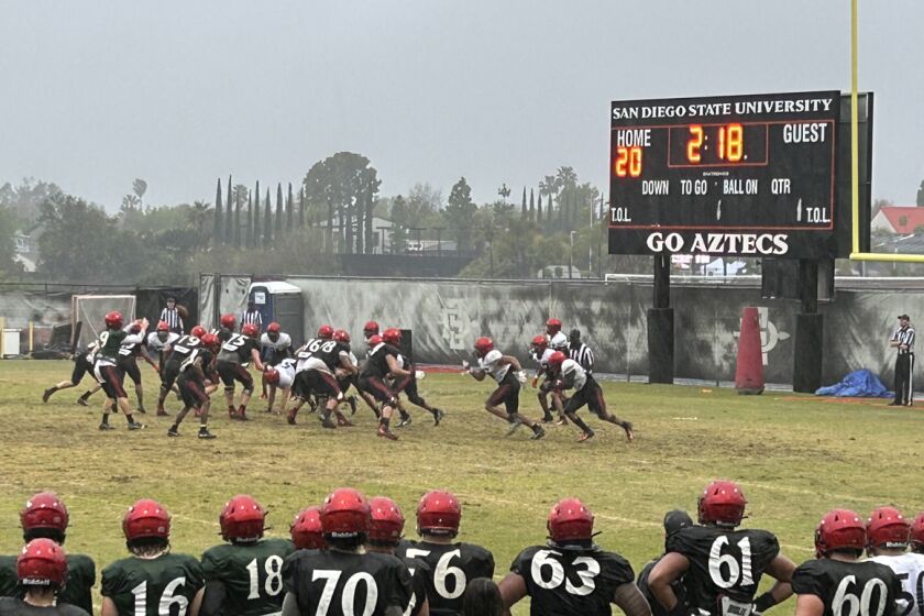 San Diego State players get after it near the goal line during Friday's scrimmage at the SDSU practice field.