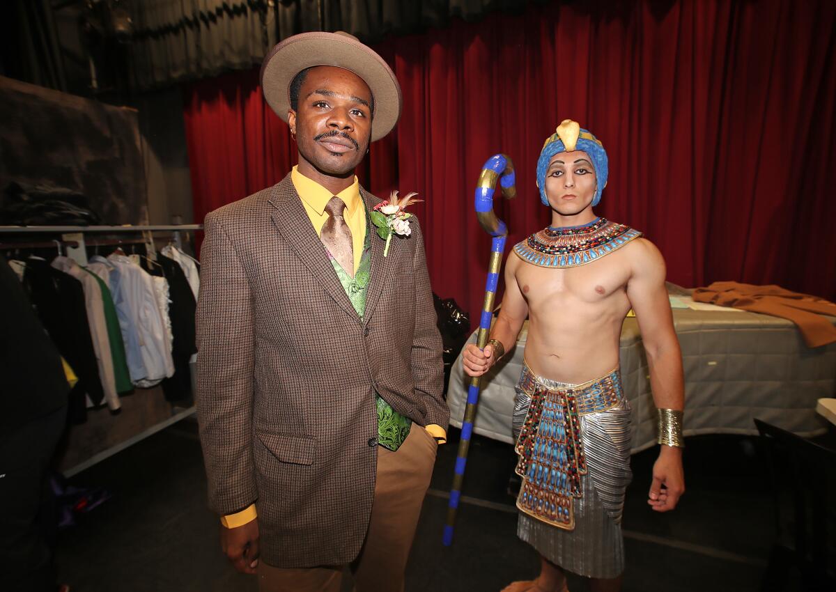 Cast members Antwon Mason Jr. and Andrue Velarde, from left, in costume for "À La Mode: The Art of Fashion."