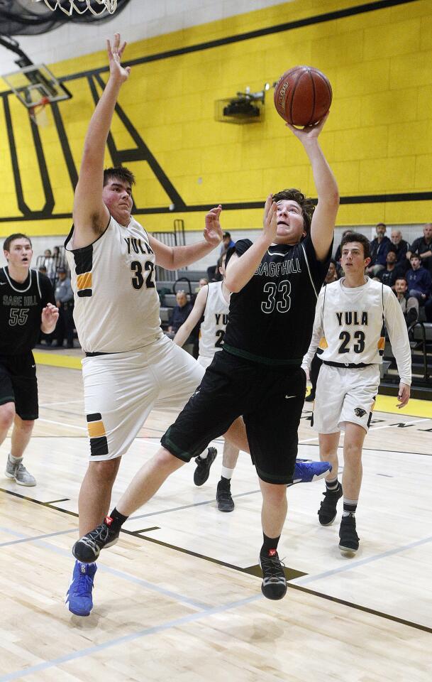 Sage Hill School's Cooper Green shoots and scores after being fouled by Yeshiva University's Elie Ibgui in a CIF Southern Section Division 5AA quarterfinal playoff game on the road Thursday.