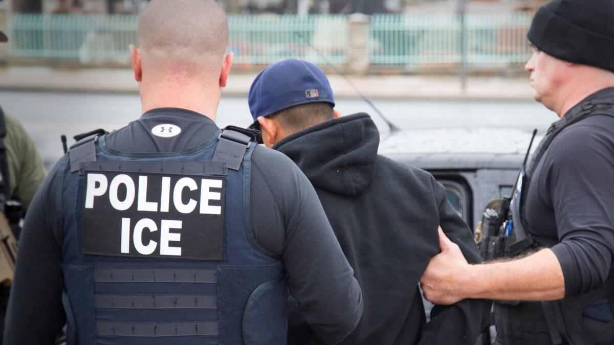 U.S. Immigration and Customs Enforcement agents arrest a foreign national in Los Angeles on Feb. 7, 2017.