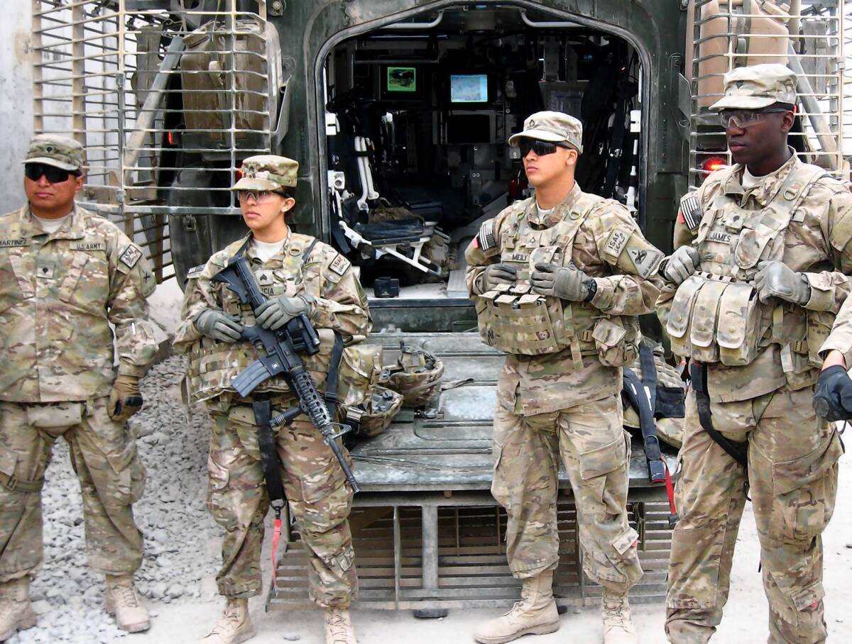 Sgt. Diana Garcia attends a briefing before going on a mission with members of the 3rd Battalion, 41st Infantry Regiment, in Zhari district in southern Afghanistan's Kandahar province.