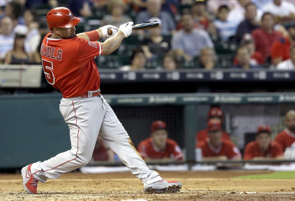 Angels first baseman Albert Pujols hits an RBI single against the Houston Astros during the second inning of a game on July 28.