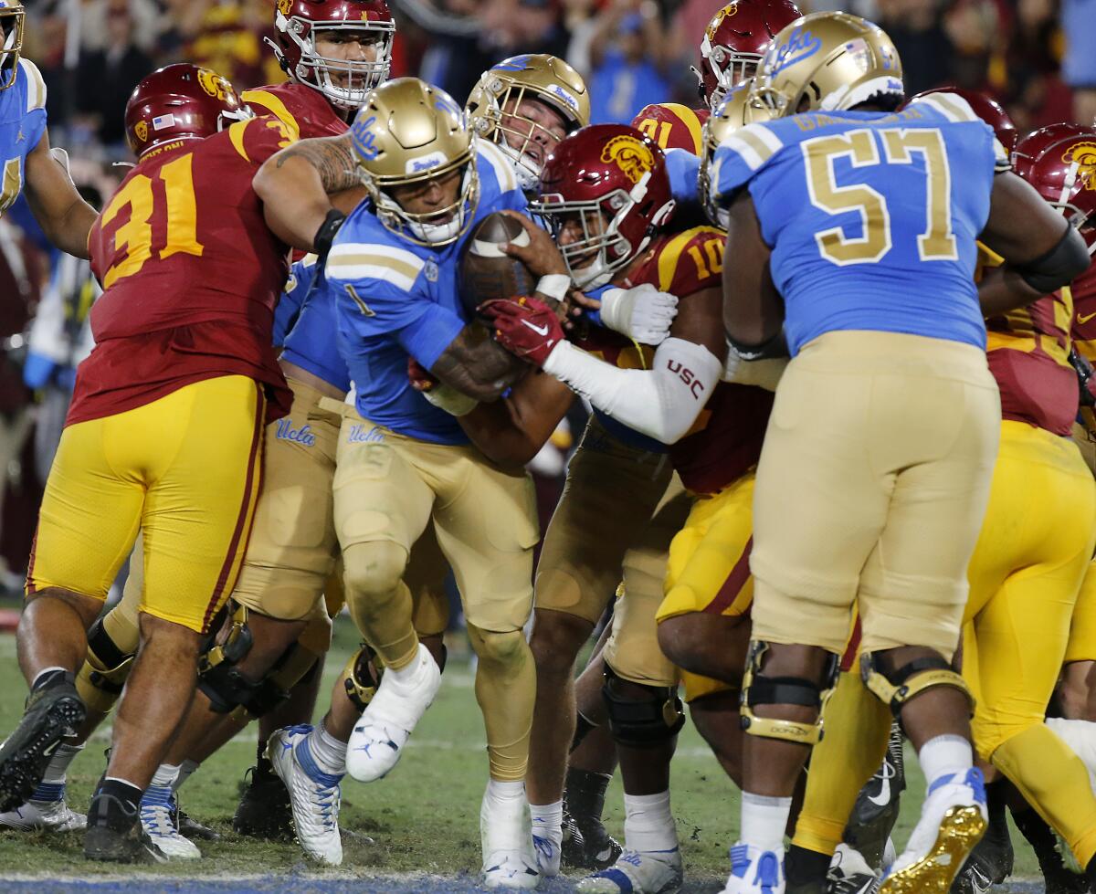 UCLA quarterback Dorian Thompson-Robinson busts into the end zone against USC 