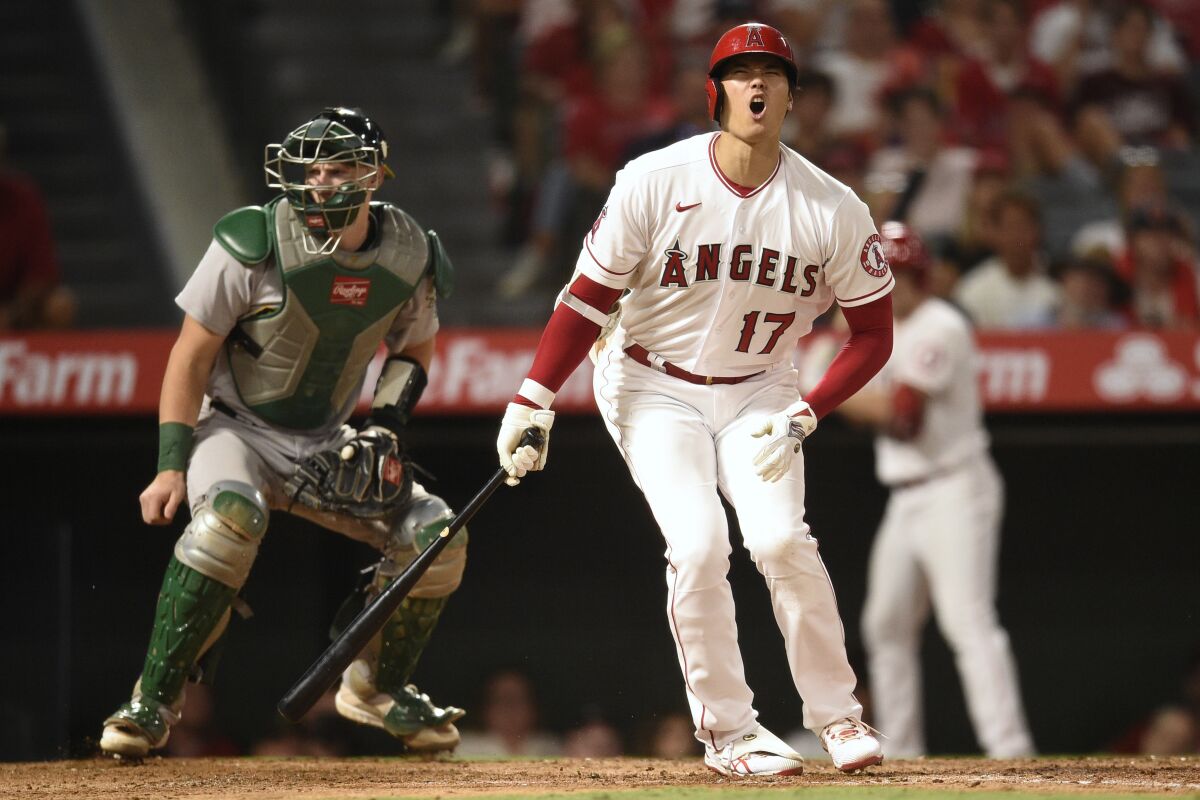The Angels' Shohei Ohtani reacts after a strike during the fifth inning against the Oakland Athletics on Thursday night.