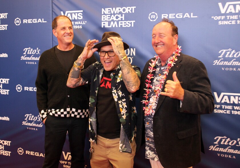 Doug Palladini, president of Vans, from left, Christian Hosoi, Pro Skater, and Steve Van Doren, Paul Van Doren's son, pose.
