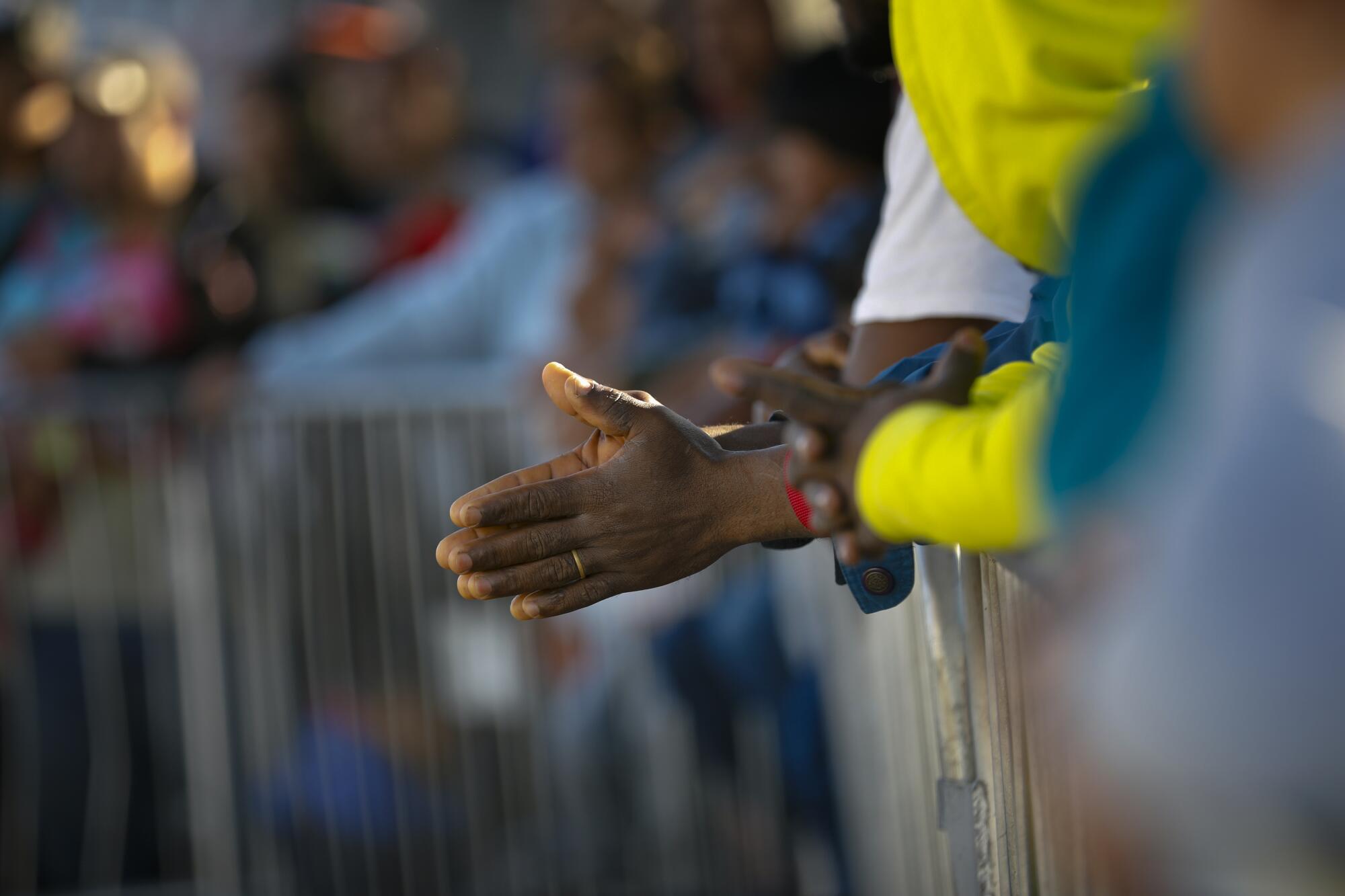 The hands of a migrant waiting in Tijuana on Oct. 24, 2019, for numbers in the asylum line to be called.