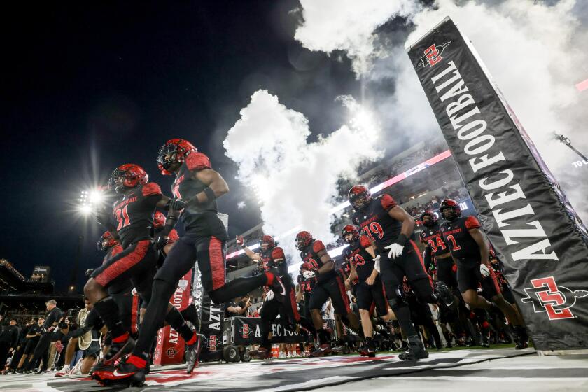 SAN DIEGO, CA - SEPTEMBER 02, 2023: Aztecs players runoff to the field as they prepare to play against Idaho State at Snapdragon Stadium in San Diego on Saturday, September 02, 2023. (Hayne Palmour IV / For The San Diego Union-Tribune)