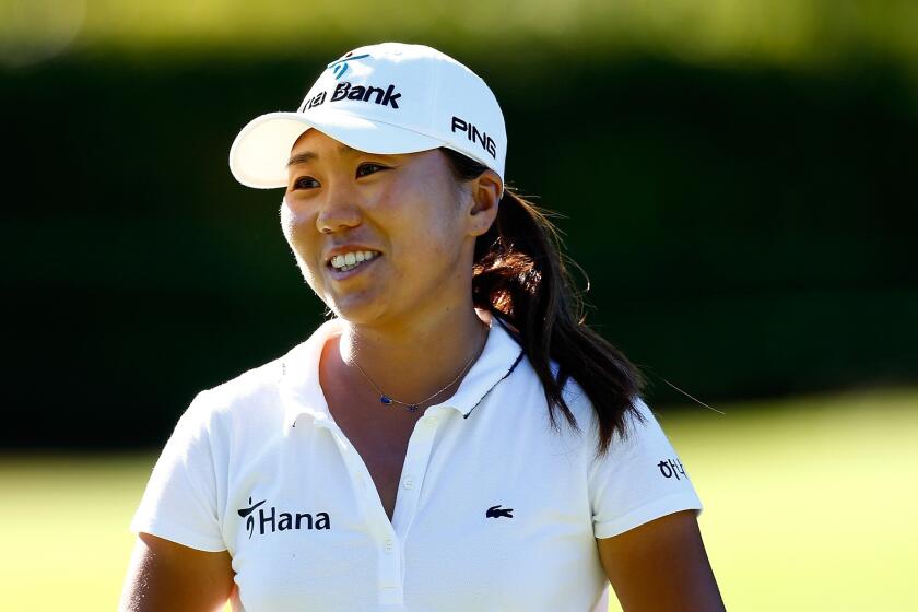 I.K. Kim of South Korea smiles after making birdie put on the 11th hole during the first round of the Portland Classic at the Columbia Edgewater Country Club.