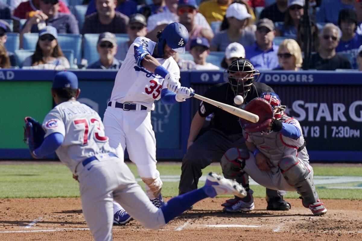 Cody Bellinger hits a two-run home run off of the Cubs' Adbert Alzolay on June 27. 