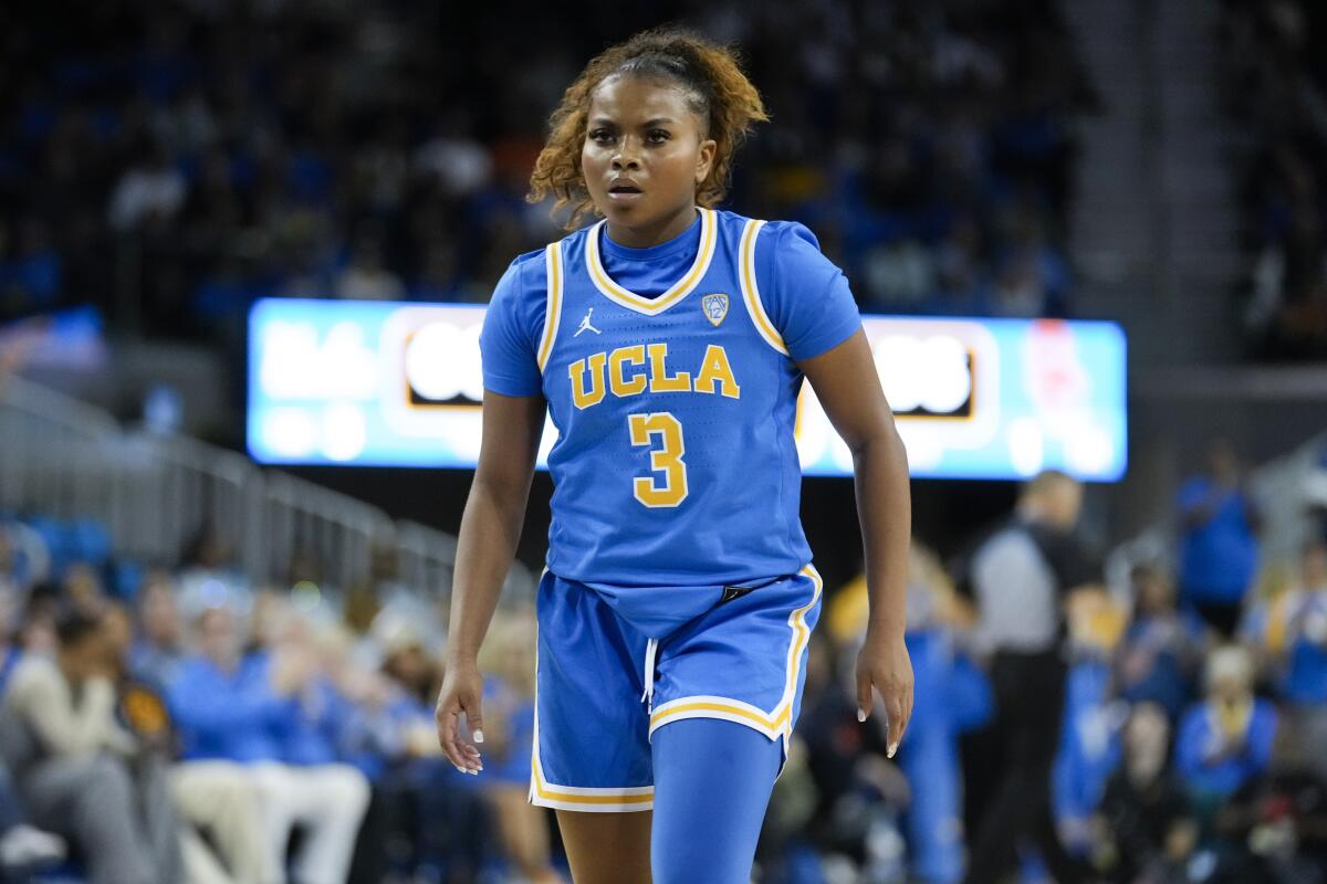 UCLA guard Londynn Jones stands on the court during a game against USC.