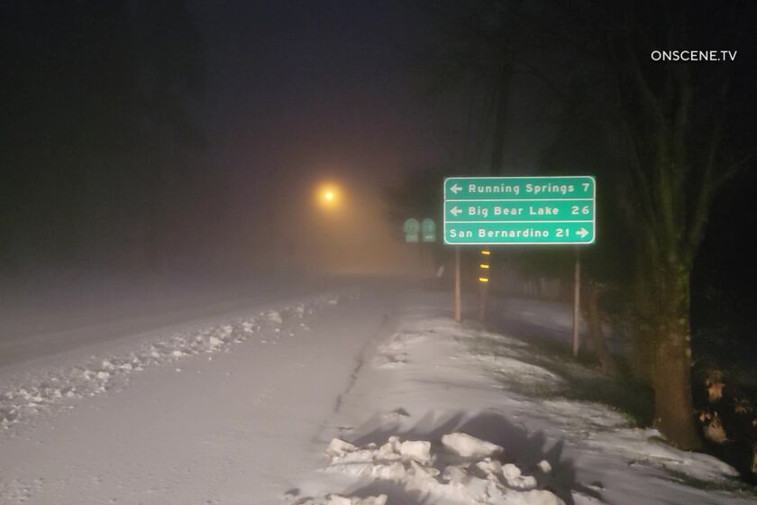 Snow began to fall early Tuesday morning in the San Bernardino National Forest as a winter storm moved into the area.