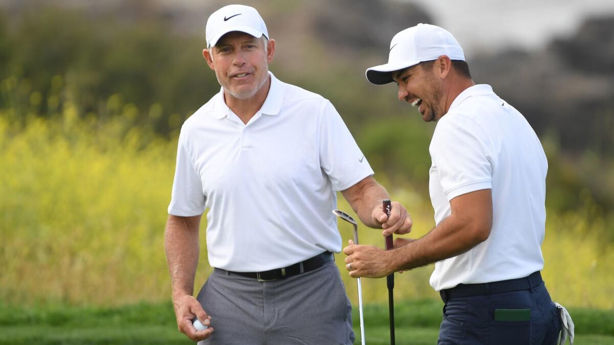 Jason Day and his caddie, Steve Williams, talk on the green during a practice round prior to the 2019 U.S. Open at Pebble Beach Golf Links on Wednesday in Pebble Beach.