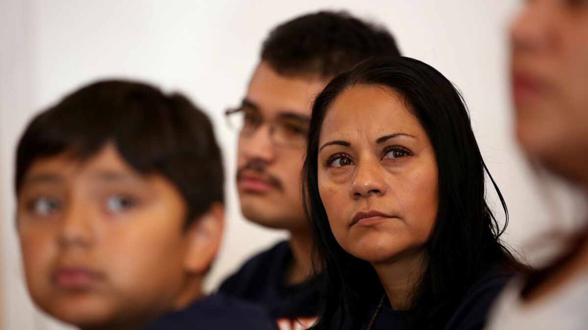 Sujey Becerra, 39, with her two sons at a wellness and nutrition class at Todec Legal Center in Perris, California, in May 2015. Becerra is an undocumented immigrant without health insurance and depends on county-run health programs.