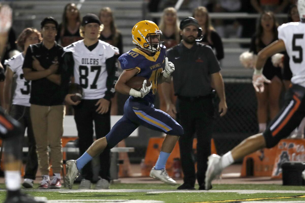 Marina's Brantt Riederich, shown running for a touchdown against Huntington Beach on Sept. 20, had three rushing scores in a 42-8 win over Laguna Hills in the first round of the CIF Southern Section Division 11 playoffs on Nov. 8.
