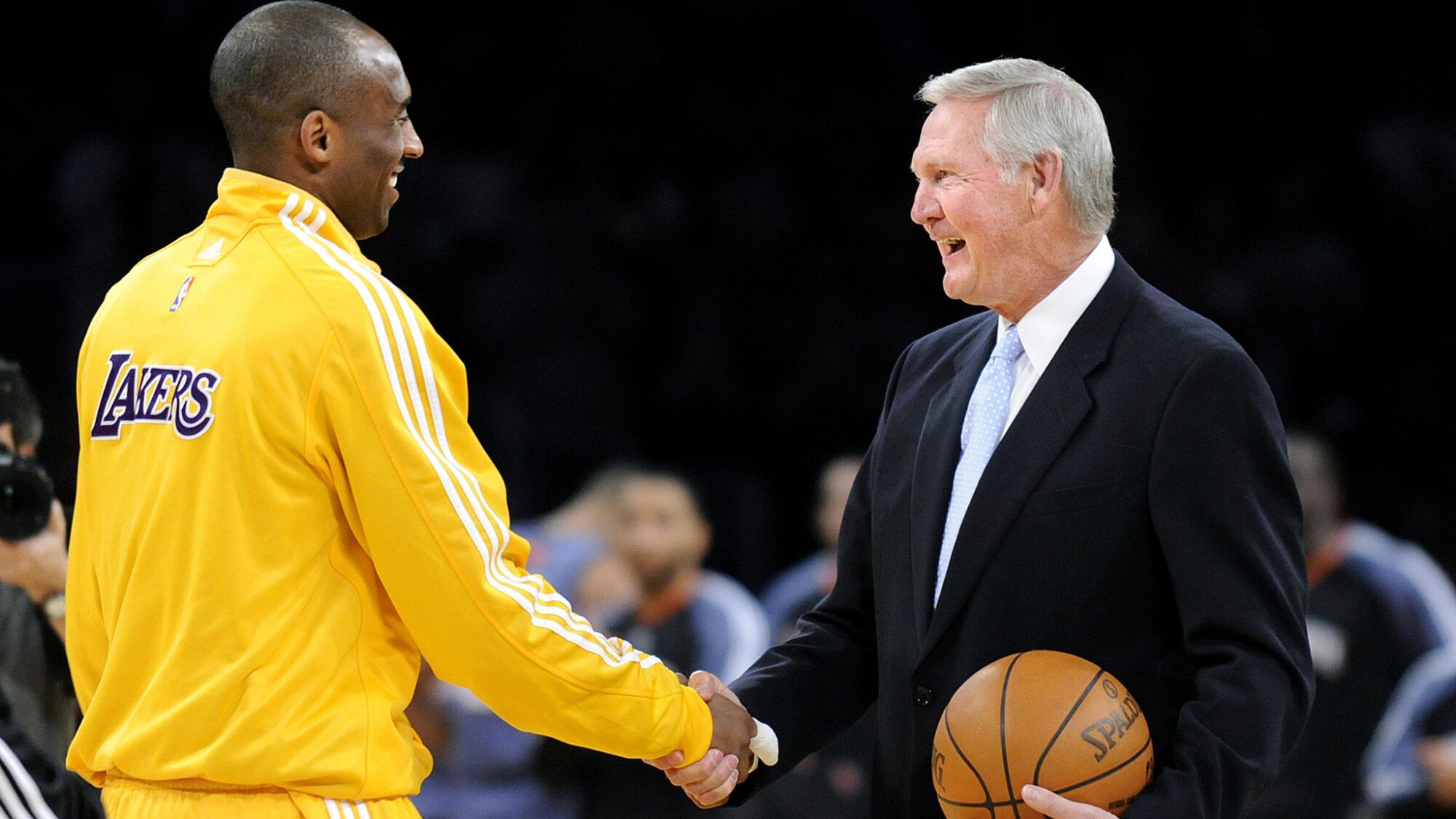 Kobe Bryant is congratulated by Jerry West during a ceremony on Feb. 3, 2010, to honor Bryant as the Lakers' leading scorer.