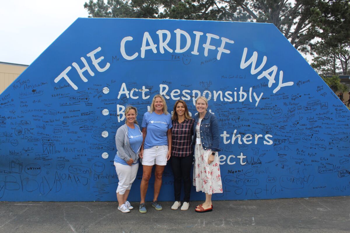 Cardiff School teacher and former student Christa Stone, Principal Julie Parker, Superintendent Jill Vinson and Cardiff School Board President Sienna Randall, also a former Cardiff student and parent.