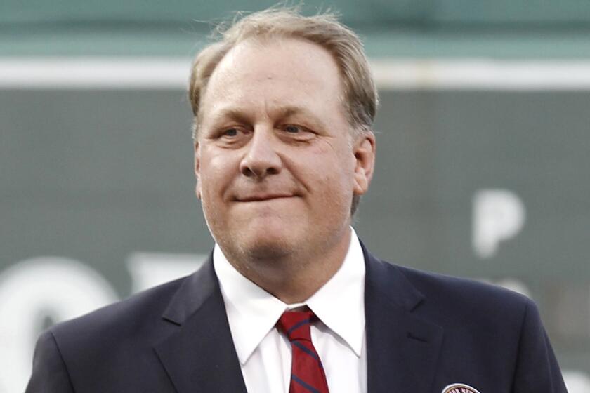 Former pitcher Curt Schilling is introduced as a new member of the Boston Red Sox Hall of Fame in August 2012. He was fired by ESPN last month.