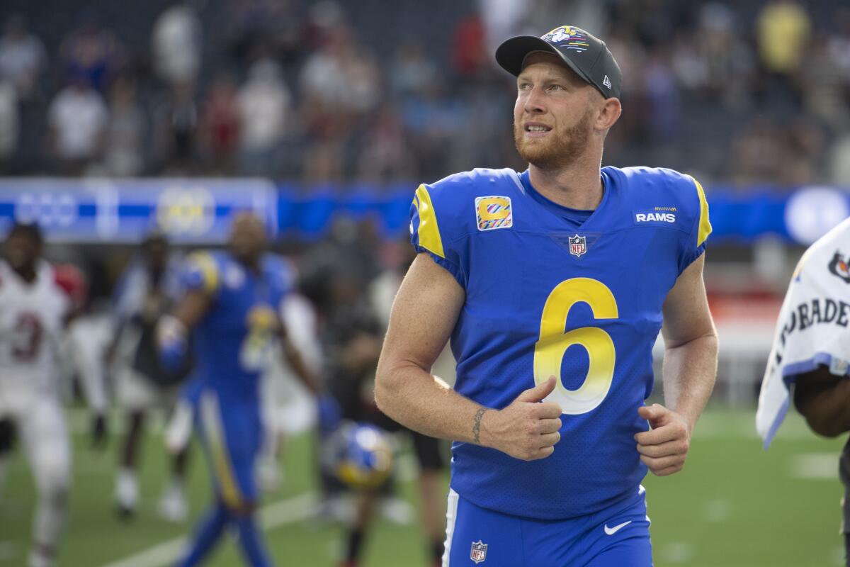 Rams punter Johnny Hekker jogs to the locker room during a game.