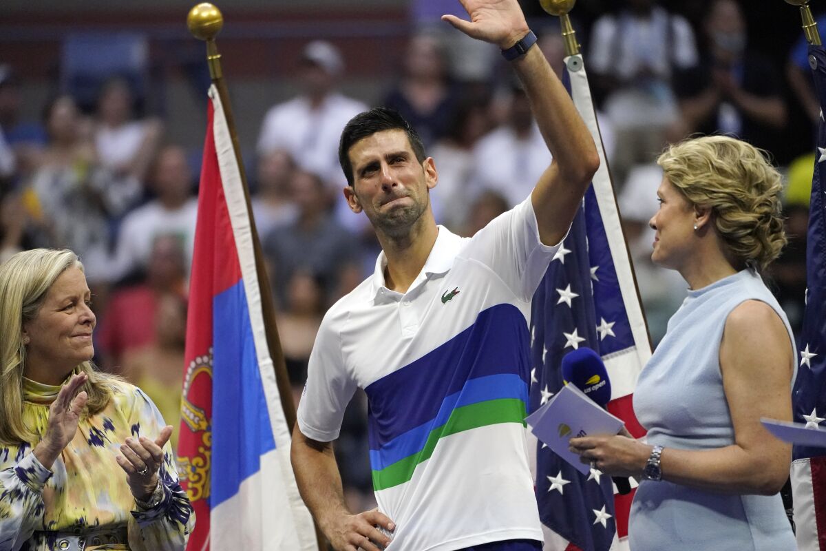 Novak Djokovic waves to the crowd after losing to Daniil Medvedev at the U.S. Open.