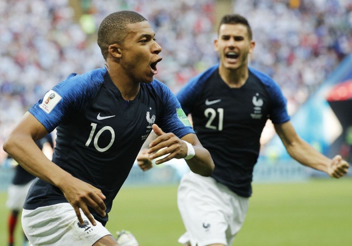 France forward Kylian Mbappe celebrates scoring one of two goals during a Round of 16 match against Argentina on June 30.