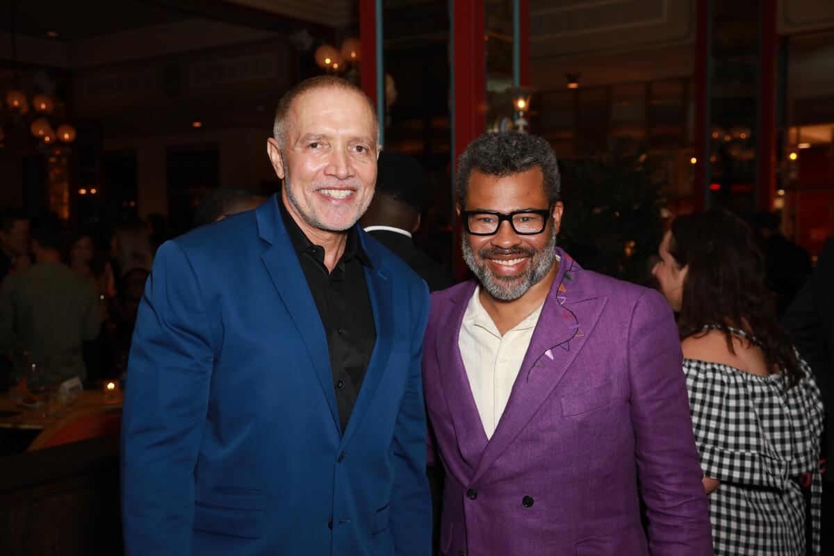 Composer Michael Abels and writer-director Jordan Peele pose for a photo at a party for their film "Nope."