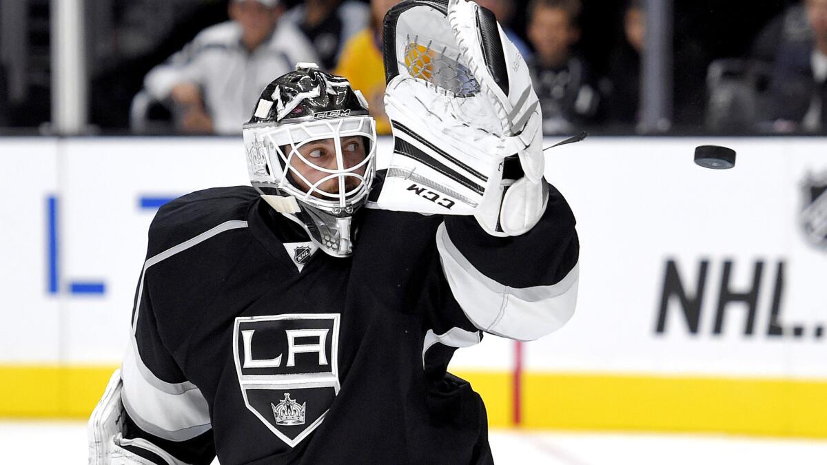 Kings goaltender Jhonas Enroth defects a shot during the third period of a preseason game against the Ducks on Sept. 29.