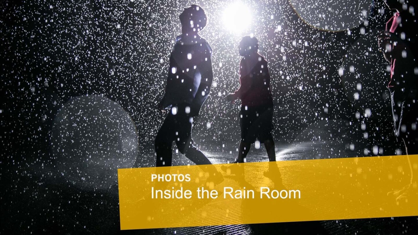 Dev Joshi, left, and Tom Stacey inside the newly assembled Rain Room, which will be on exhibit at LACMA.