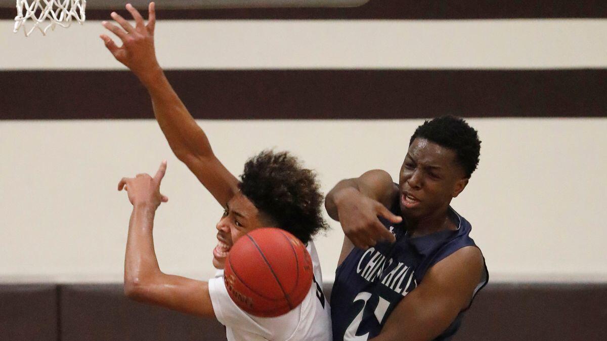 Chino Hills’ Onyeka Okongwu forcibly rejects a shot by Crespi’s Kyle Owens during the first quarter of their Southern California regional at Crespi.
