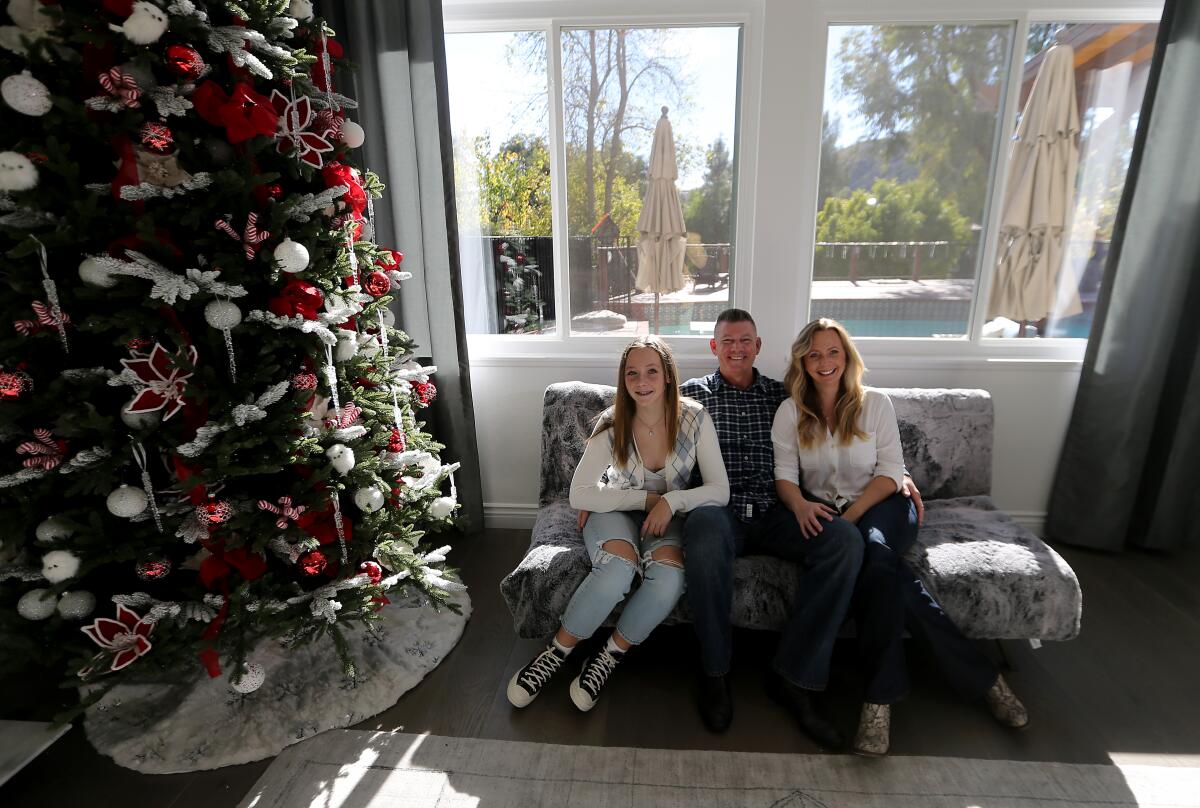 Rob and Katerina Krumwiede with daughter Sophie at the Calabasas home they recently purchased