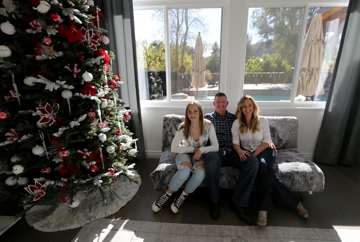 Rob and Katerina Krumwiede with daughter Sophie at the Calabasas home they recently purchased 