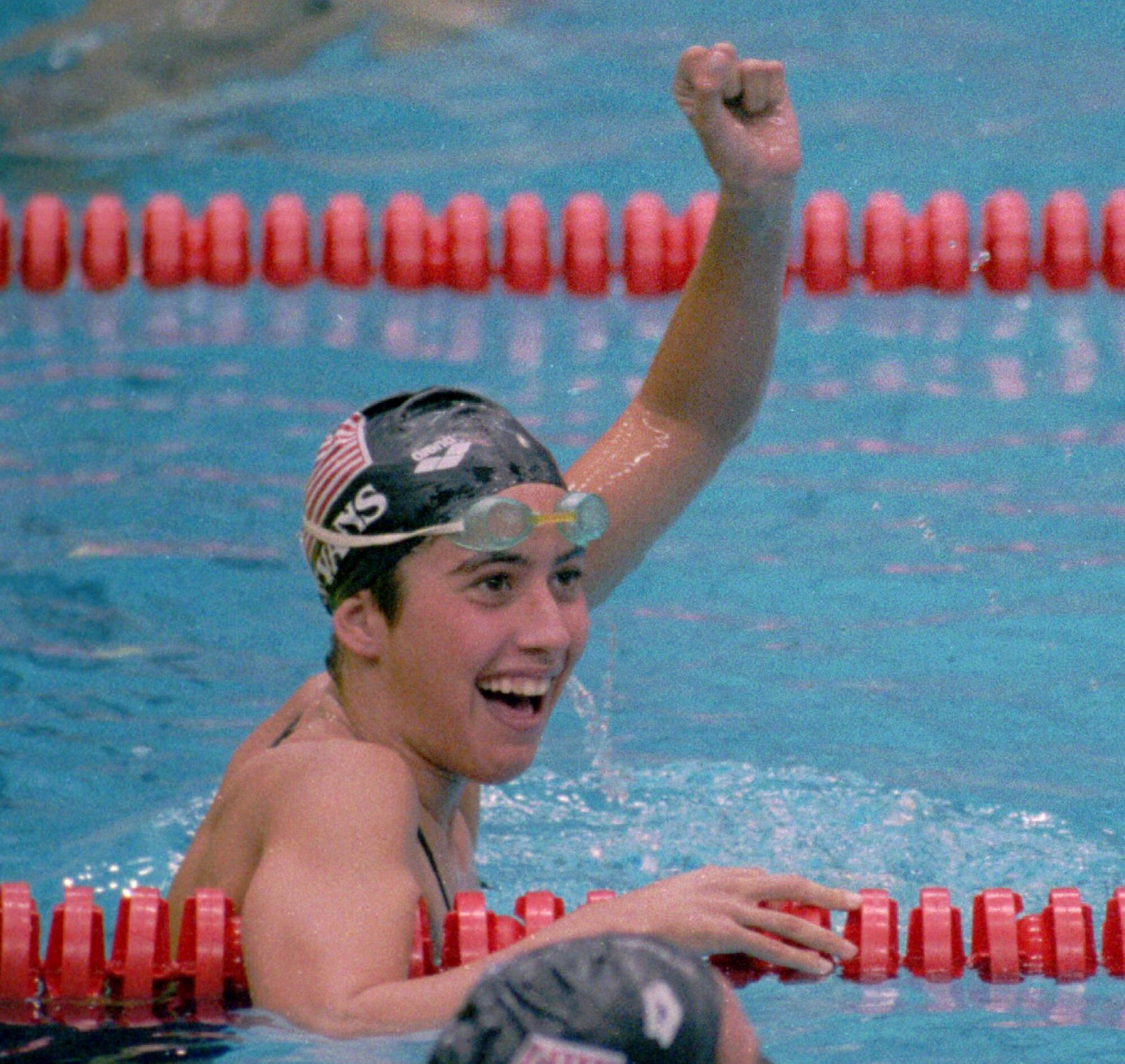 Janet Evans celebrates her Olympic gold medal performance in the 1988 Olympics.