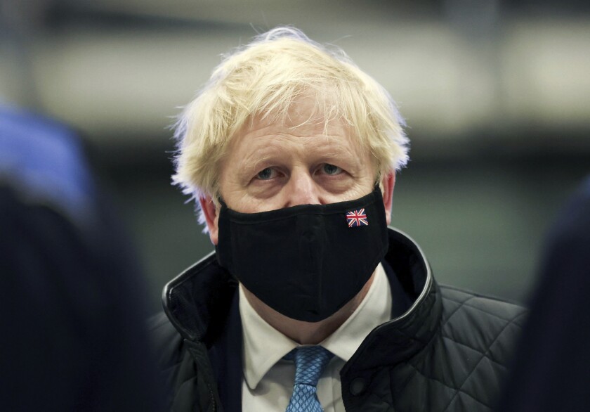 Britain's Prime Minister Boris Johnson looks on, during a visit to RAF Valley, in Anglesey, North Wales, Thursday, Jan. 27, 2022. (Carl Recine/Pool Photo via AP)